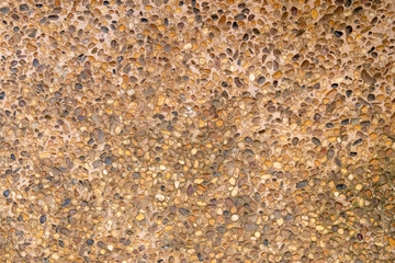 round sea stones in concrete, outdoor flooring, texture