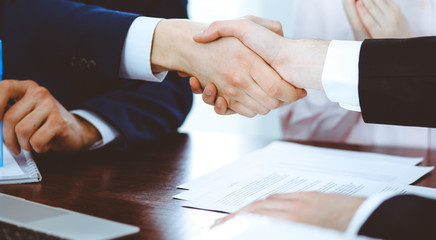 Obraz premium Business people shaking hands finishing up a meeting. Handshake at successful negotiation