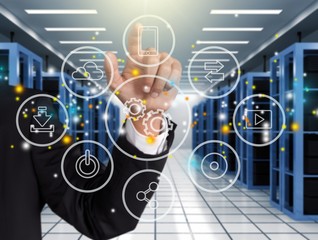 Businessman and analytics symbols on blurred background