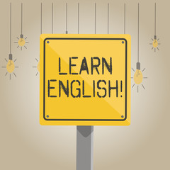 Fototapeta premium Writing note showing Learn English. Business concept for gain acquire knowledge in new language by study 3D Square Colorful Caution Road Sign with Black Border Wood