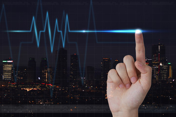 Male hand touching electrocardiogram on visual screen