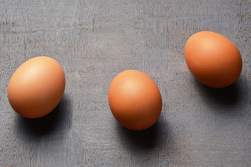 Group of eggs on the black wood background with copy space