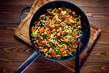Fried vegetables with pork. Prepared  in a pan.