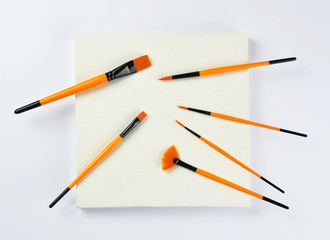 Paint brushes on canvas frame