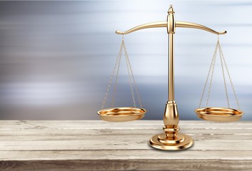Law scales on table background. Symbol of justice