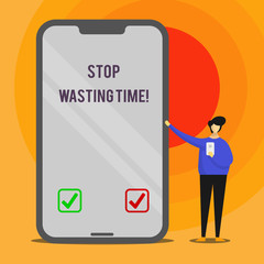 Word writing text Stop Wasting Time. Business photo showcasing advising demonstrating or group start planning and use it wisely Man Presenting Huge Blank Screen Smartphone while Holding Another Mobile