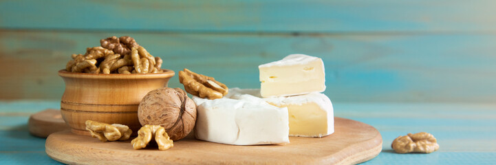 Cheese camembert or brie with walnut kernels