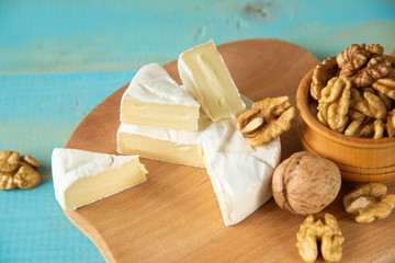 Cheese camembert or brie with walnut kernels
