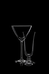 Glassware silhouettes on black.
