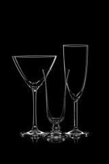 Glassware silhouettes on black.