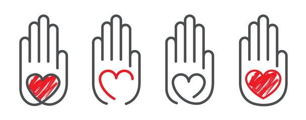 Red heart of love in the palm