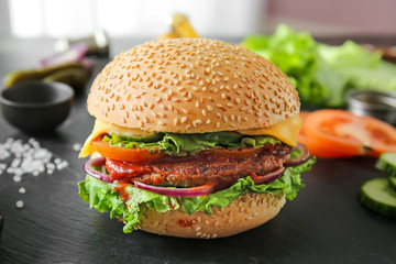 Tasty fresh burger on table