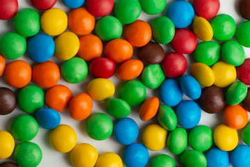 Fototapeta na wymiar Colorful chocolate candies background