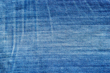 Textures of blue jeans denim fabrics for the background.