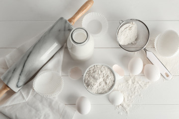 Fresh ingredients for bakery on white table