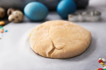Dough for tasty Easter cookies on table