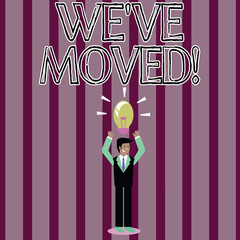 Handwriting text We Ve Moved. Conceptual photo having strong feelings sadness or sympathy has said or done Businessman Standing Raising Arms Upward with Lighted Bulb Icon on his Head