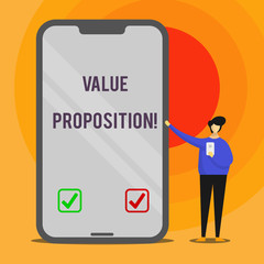 Word writing text Value Proposition. Business photo showcasing innovation service intended make product attractive Man Presenting Huge Blank Screen Smartphone while Holding Another Mobile