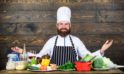 Dieting with organic food. Fresh vegetables. Professional chef in cook uniform. Vitamin. man use kitchenware. Happy man cooking in kitchen. Healthy food and vegetarian. Having a healthy breakfast