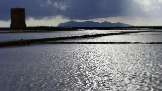 Rapidly changing weather over the Salt Flats of Trapani, Province of Trapani, Sicily, Italy