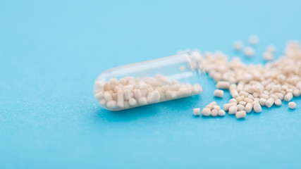 Closeup of open medical capsule pill