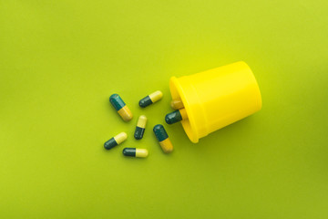 Green and yellow medical capsules