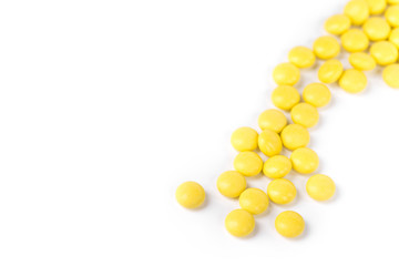 Closeup of yellow pills isolated