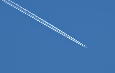 Plane traces on the blue sky