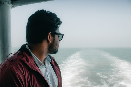 Young Men looking forword to the see on a ship