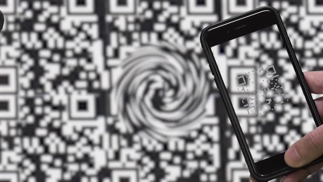 QR CODE look alike black and white pattern (CAN NOT SCAN THIS) and SMARTPHONE.  Image of scanning QR CODE.  Blurred moving black and white pattern background.