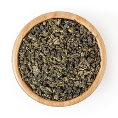 Milk oolong green tea in wooden bowl isolated on white background with clipping path