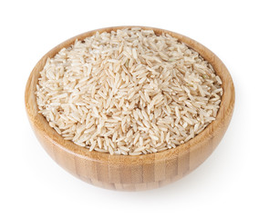 Brown rice in wooden bowl isolated on white background with clipping path