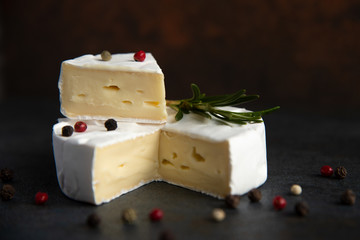 Cheese camembert or brie with fresh rosemary