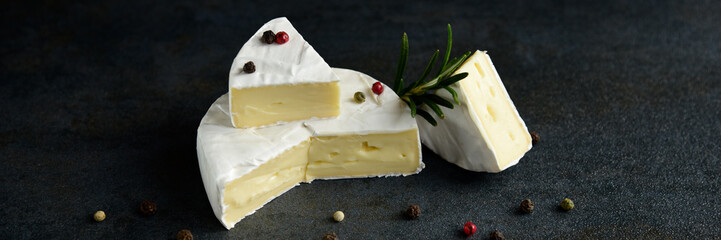Cheese camembert or brie with fresh rosemary