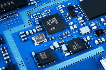 Macro shot of Circuit board with resistors microchips and electronic components. Computer hardware technology. Integrated communication processor. Information engineering. Semiconductor. PCB. Closeup