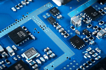 Macro shot of Circuit board with resistors microchips and electronic components. Computer hardware technology. Integrated communication processor. Information engineering. Semiconductor. PCB. Closeup