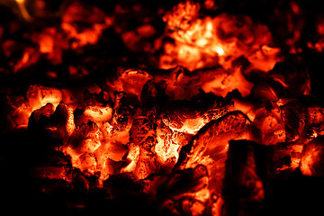 Hot coals in fireplace, fire background, close-up, macro.