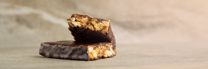 Muesli and cereal bar on marble stone background