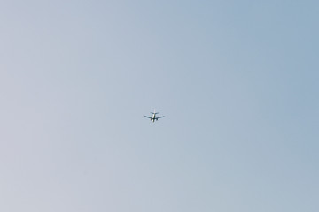 Aeroplane flying towards summer destination.