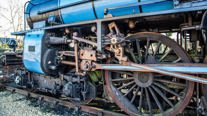 Fototapeta na wymiar Blue steam locomotive wheels