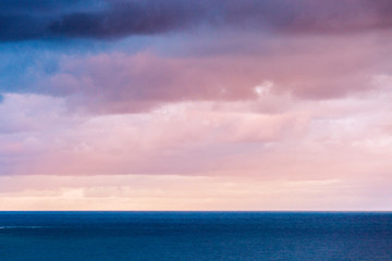 Vivid ocean dusk seascape cloudscape over ocean.
