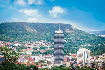Panoramic view of hills, old town and tower. Jena, Germany
