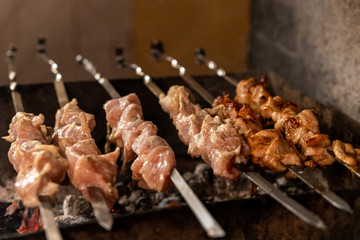 Grilled pieces of delicious rump beef over flames