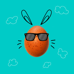 Easter egg with  bunny ears and sunglasses