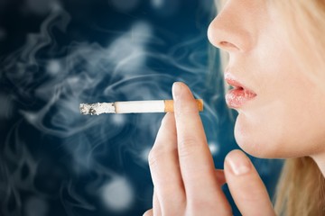 Portrait of the beautiful elegant girl smoking cigarette isolated