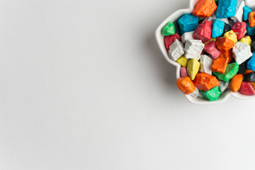 A bowl of multicolor chocolate candies