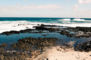 Fototapeta na wymiar Ocean Waves on Island Coast and Shoreline Landscape Nature Photo