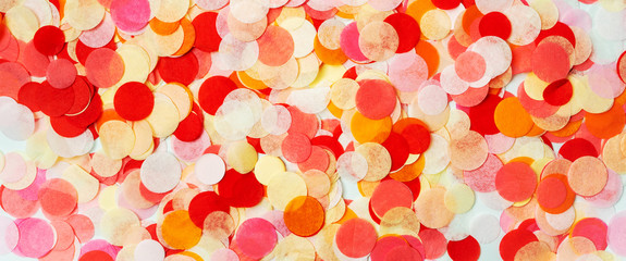 Close view of colorful bright confetti textured background.