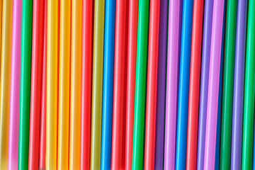 Obraz premium Heap of plastic multi-colored straws for cocktail