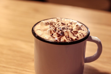 Hot chocolate and chocolate pieces isolated on white background